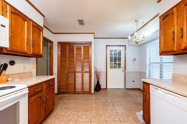 kitchen featuring white appliances, an inviting chandelier, pendant lighting, and light tile patterned flooring