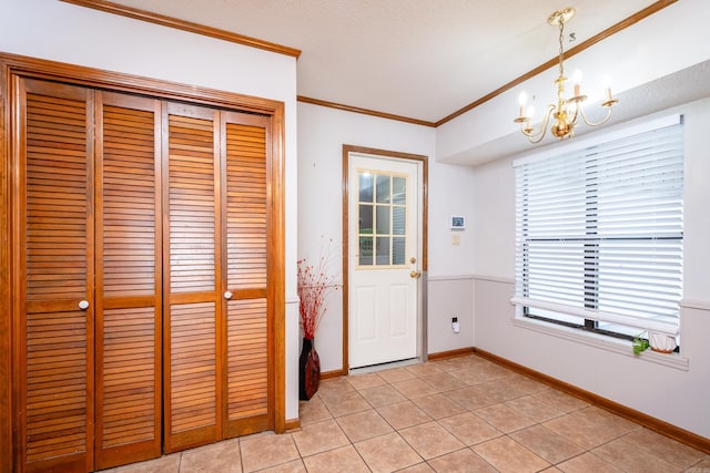 doorway to outside featuring a textured ceiling, a notable chandelier, light tile patterned floors, and crown molding