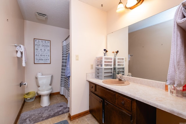 bathroom featuring toilet, tile patterned floors, curtained shower, a textured ceiling, and vanity