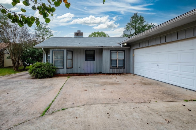 ranch-style home featuring a garage