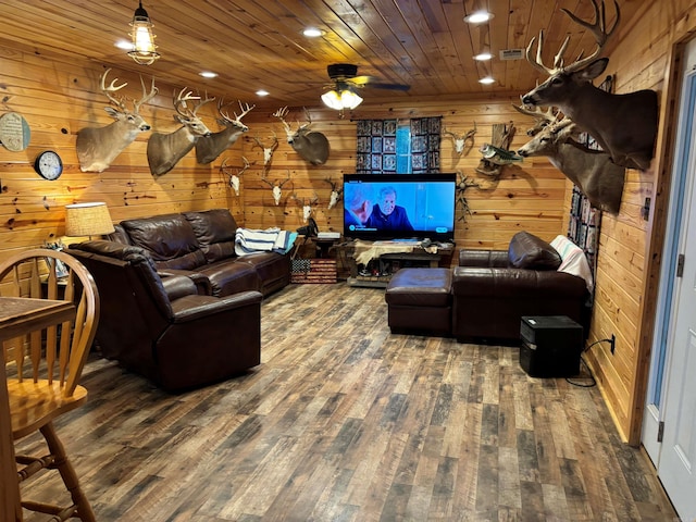 living room featuring wood-type flooring, wooden walls, and wood ceiling