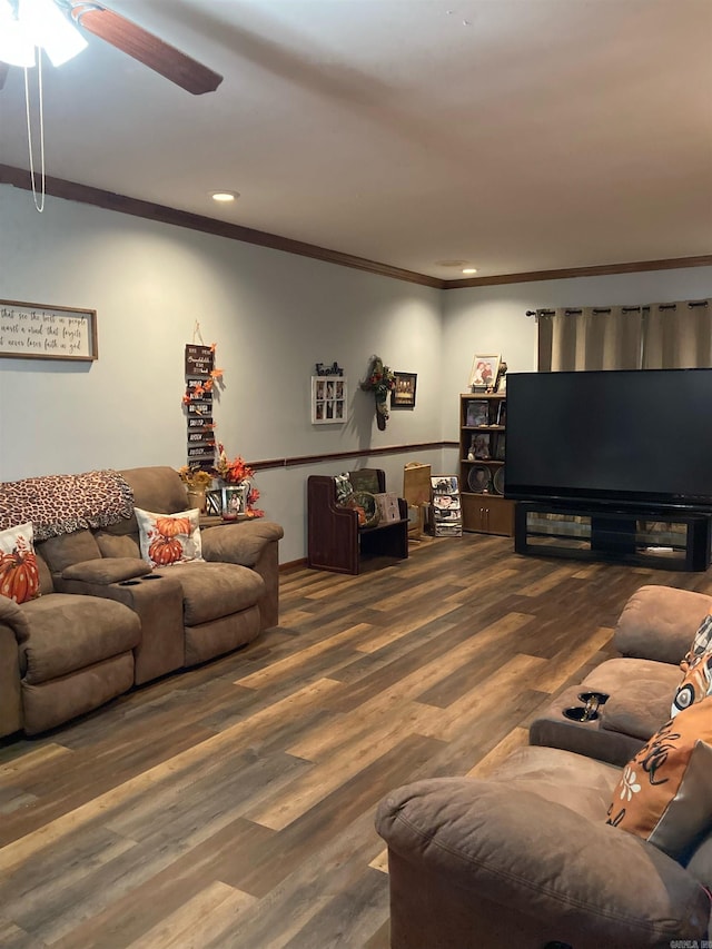 living room featuring ornamental molding, dark wood-type flooring, and ceiling fan