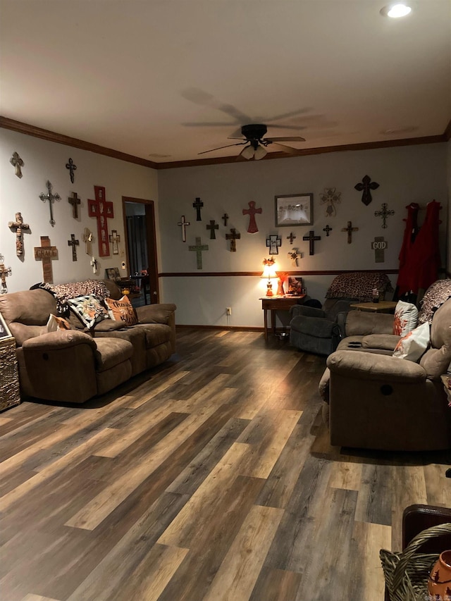 living room featuring dark wood-type flooring, ceiling fan, and ornamental molding