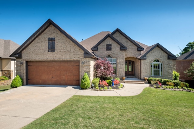 french country home with a front lawn