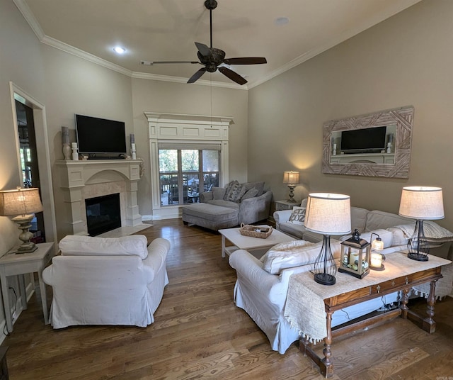 living room with wood-type flooring, ceiling fan, and crown molding