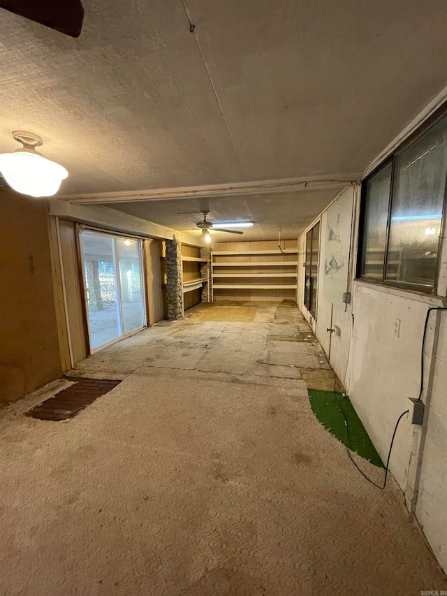 interior space featuring ceiling fan