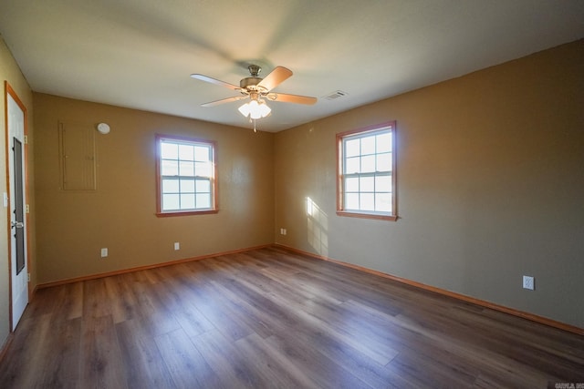 unfurnished room featuring hardwood / wood-style floors, ceiling fan, and plenty of natural light