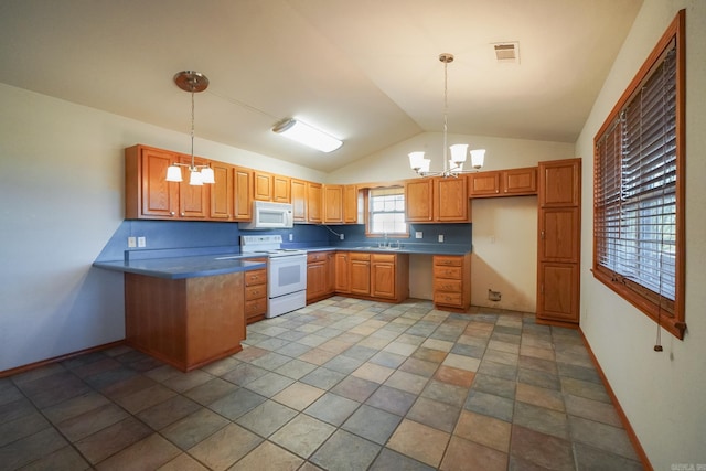 kitchen with hanging light fixtures, white appliances, lofted ceiling, and a notable chandelier