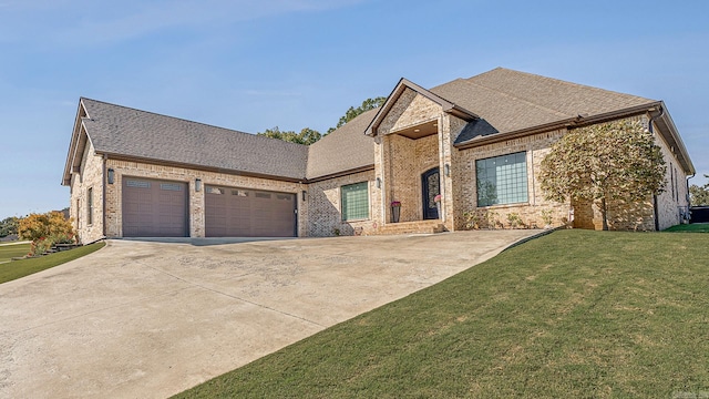 view of front facade with a front lawn and a garage