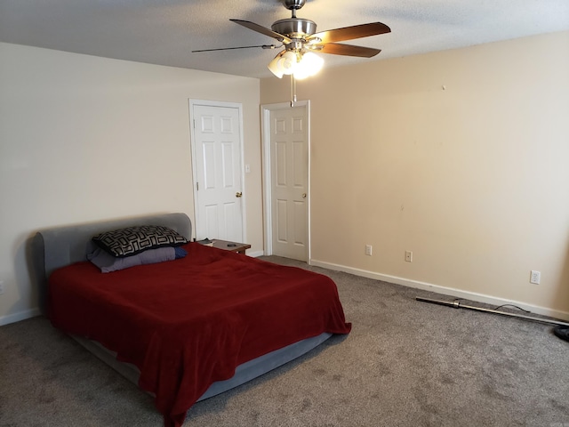 bedroom featuring ceiling fan and carpet floors