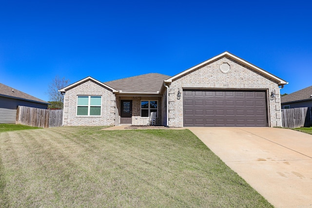 view of front facade with a garage and a front yard