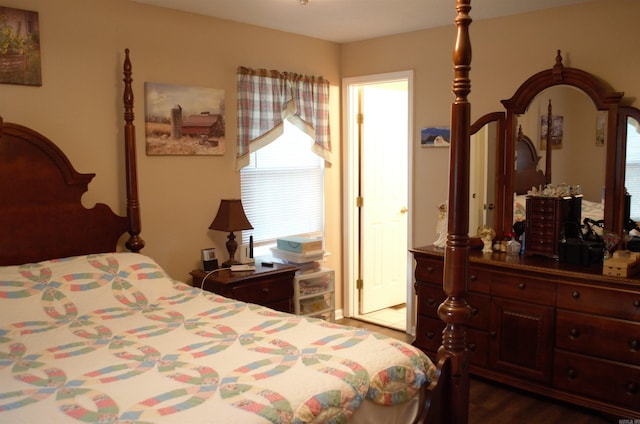 bedroom with dark hardwood / wood-style flooring