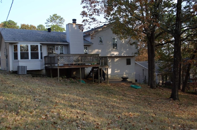 back of house featuring a yard, central air condition unit, and a wooden deck