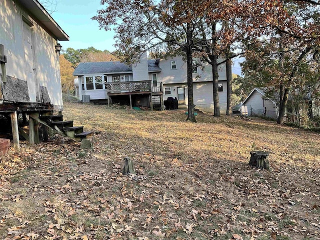 view of yard with a wooden deck and cooling unit