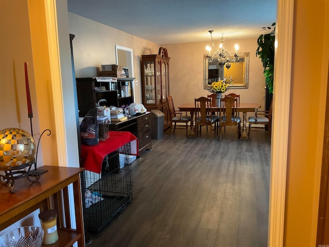 interior space featuring a notable chandelier and dark wood-type flooring