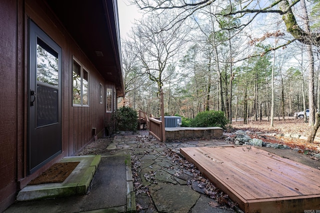 view of patio / terrace featuring central AC unit and a wooden deck