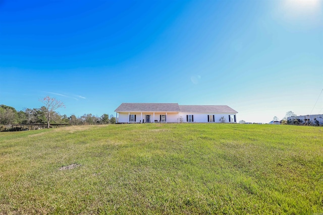 single story home featuring a front yard