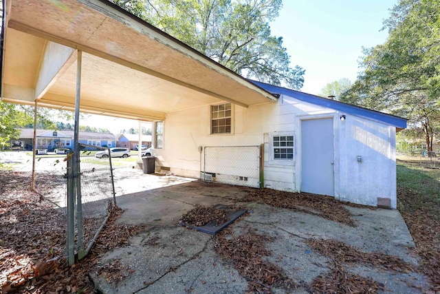 exterior space featuring a carport