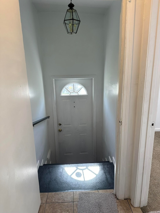 entryway featuring light tile patterned flooring