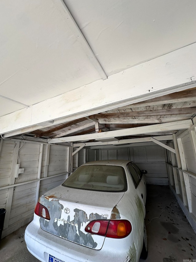 garage featuring wooden walls