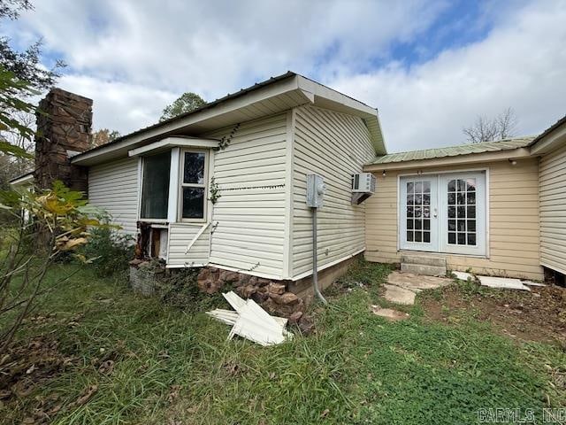 view of home's exterior with french doors