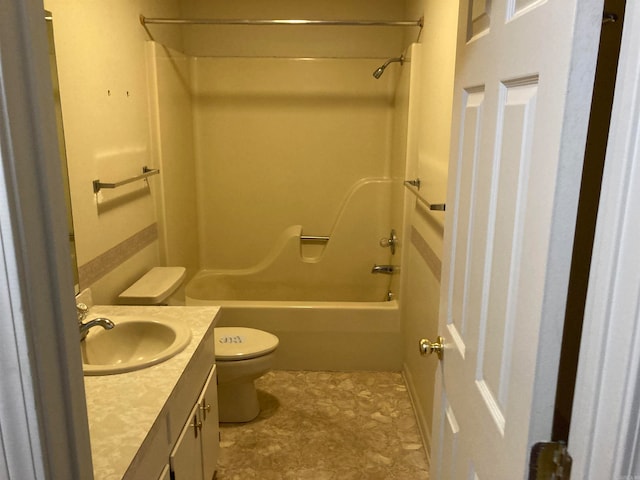 full bathroom with toilet, vanity, and shower / washtub combination