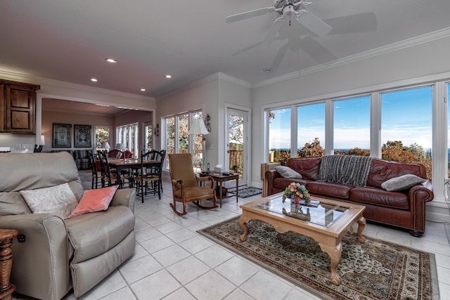 tiled living room featuring ceiling fan and ornamental molding