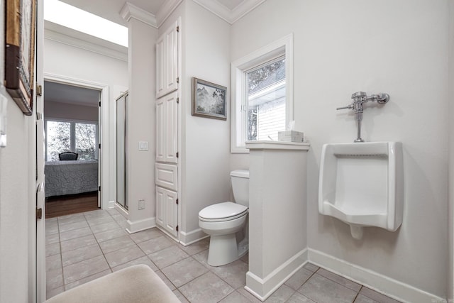 bathroom featuring toilet, tile patterned flooring, a healthy amount of sunlight, and crown molding