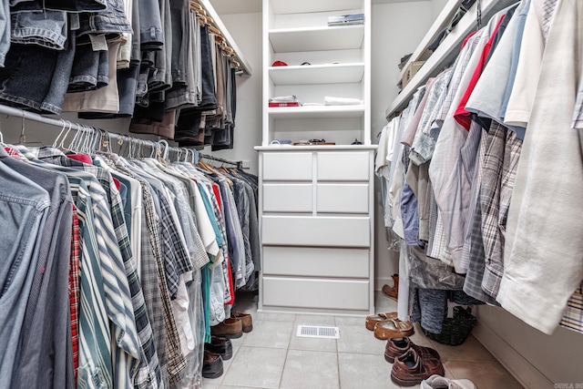 spacious closet featuring light tile patterned floors