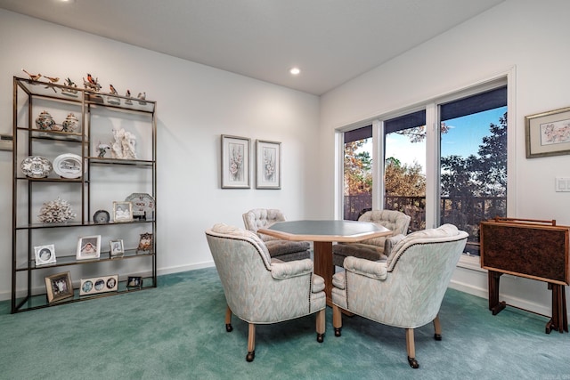 dining area with dark carpet