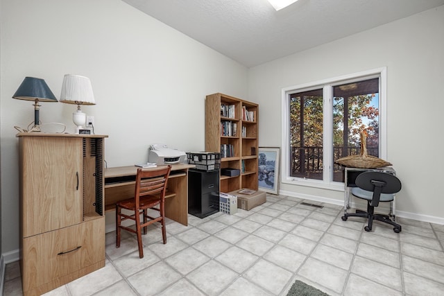 office space with tile patterned flooring