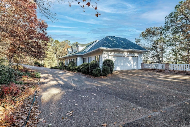 view of property exterior featuring a garage