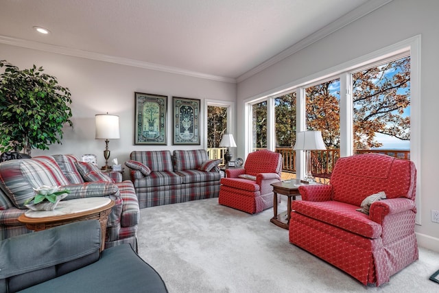 carpeted living room featuring ornamental molding