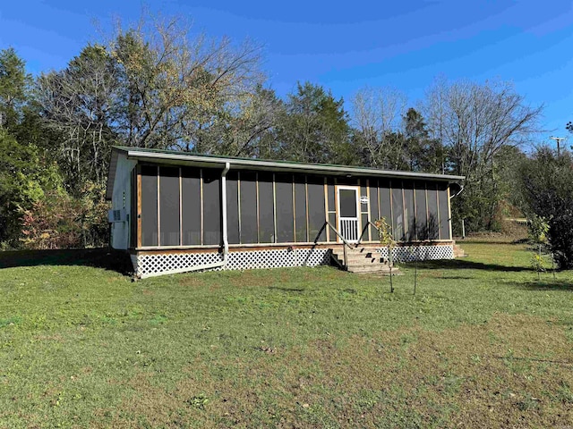 view of outdoor structure with a sunroom