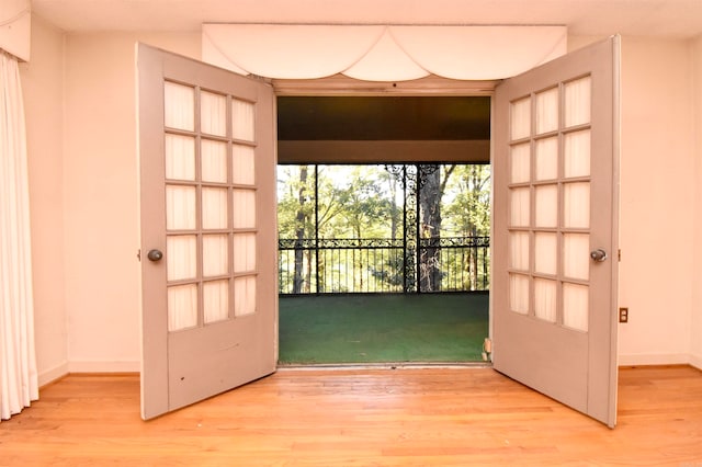 doorway to outside with hardwood / wood-style floors