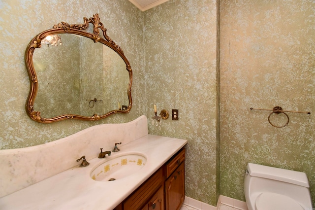 bathroom featuring tile patterned flooring, vanity, and toilet