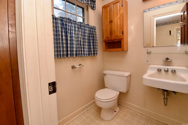 bathroom featuring toilet and sink