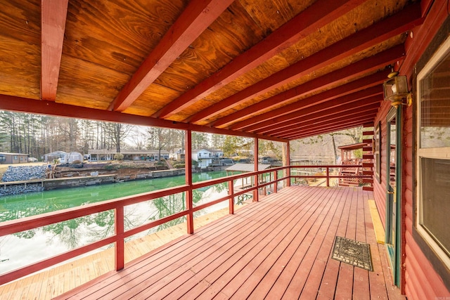 wooden deck featuring a water view