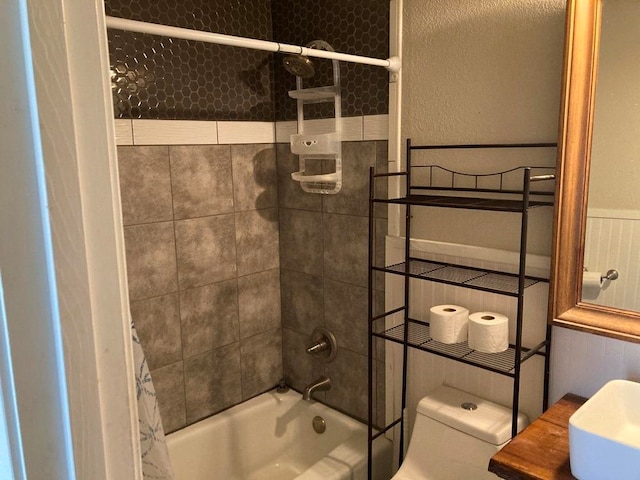 bathroom with toilet and shower / bathtub combination with curtain