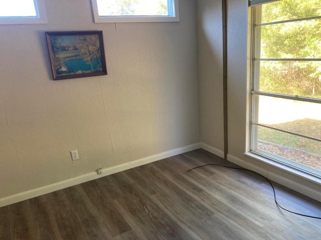 spare room with hardwood / wood-style flooring