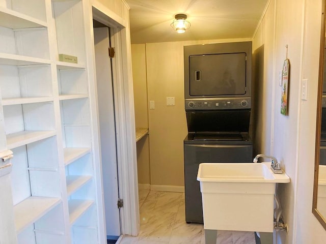 laundry area with stacked washer / drying machine