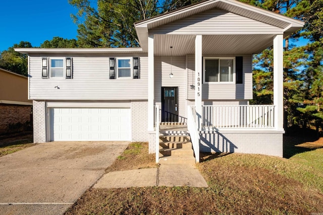 view of front of house with a garage and a porch