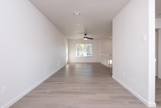 hallway with light hardwood / wood-style flooring