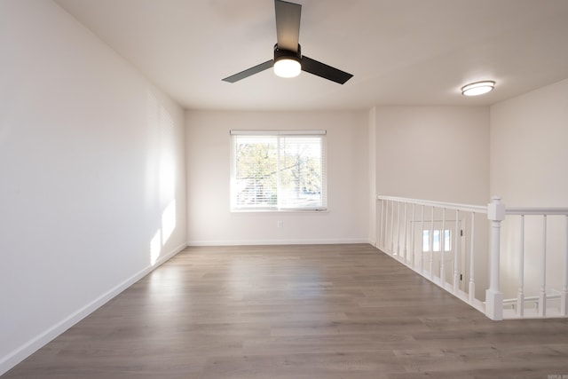 unfurnished room featuring hardwood / wood-style flooring and ceiling fan