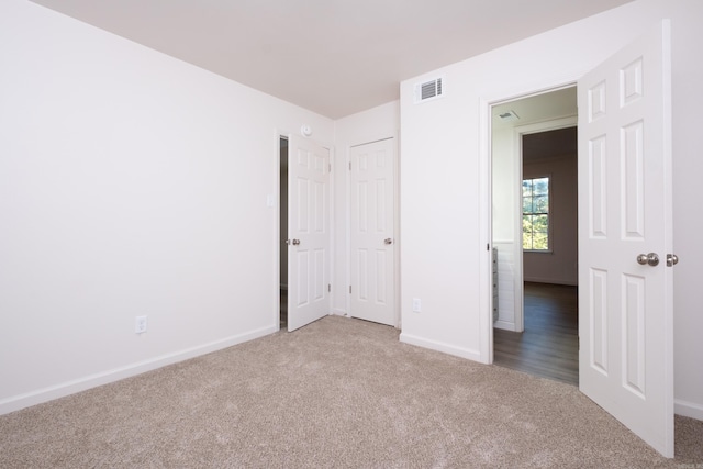 unfurnished bedroom with carpet flooring