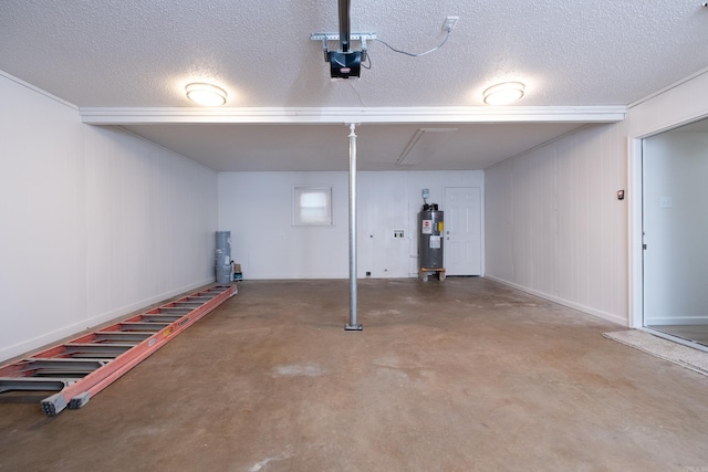 garage with water heater and a garage door opener