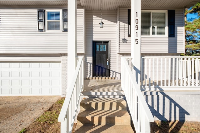 view of exterior entry featuring a garage