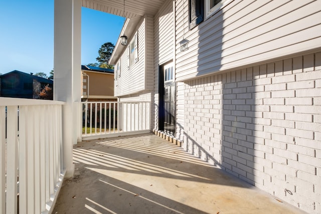 view of side of property with a porch