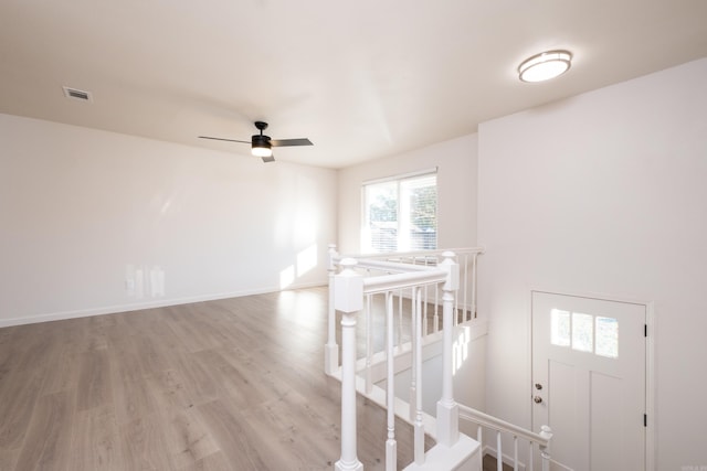 interior space featuring hardwood / wood-style floors and ceiling fan