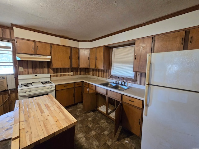 kitchen with sink, wooden counters, cooling unit, a textured ceiling, and white appliances